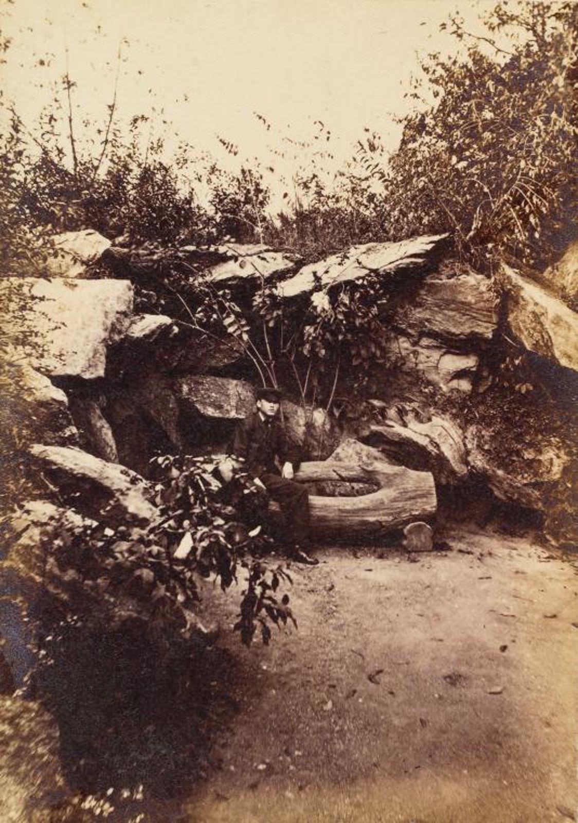 Man Seated On Rustic Bench In Rock Grotto, 1862