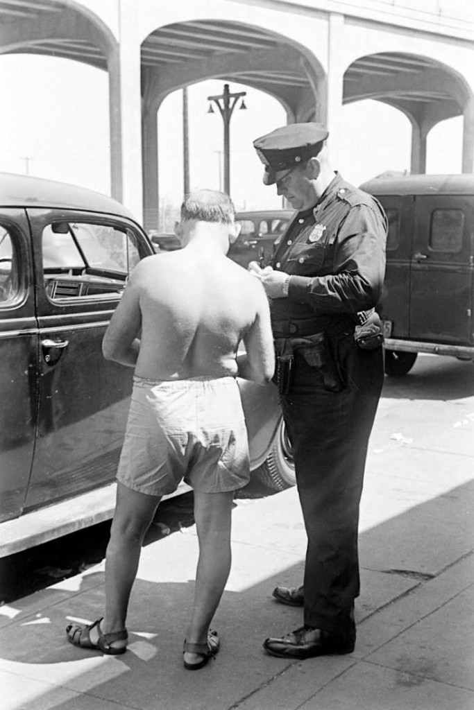 People Being Ticketed For Wearing Bathing Suits And Shorts At Rockaway Beach, 1946