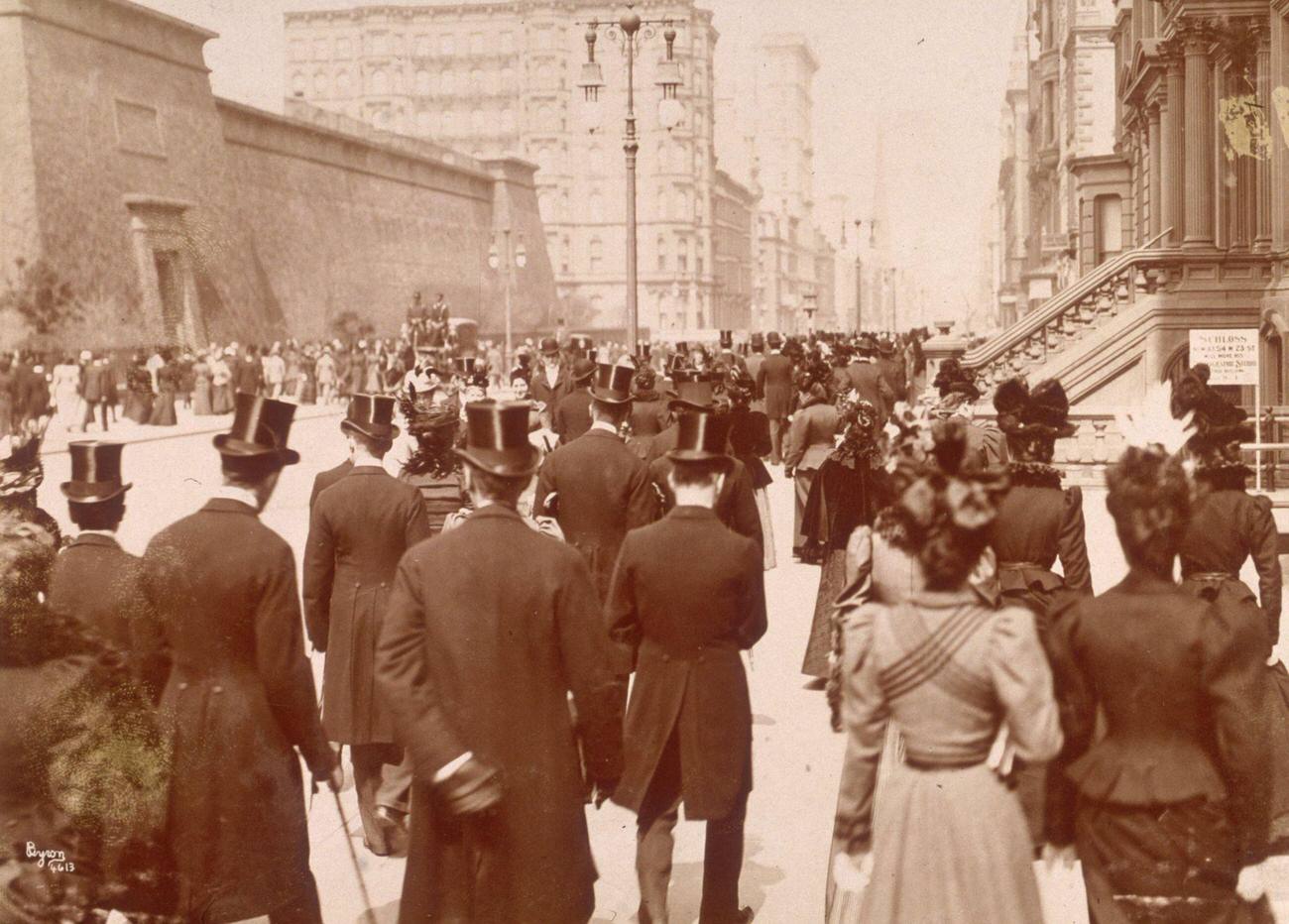 Men And Women Walk With Their Backs To The Camera, Wearing Formal Top Hats And Dresses, In The Easter Parade, On Fifth Avenue, 1893