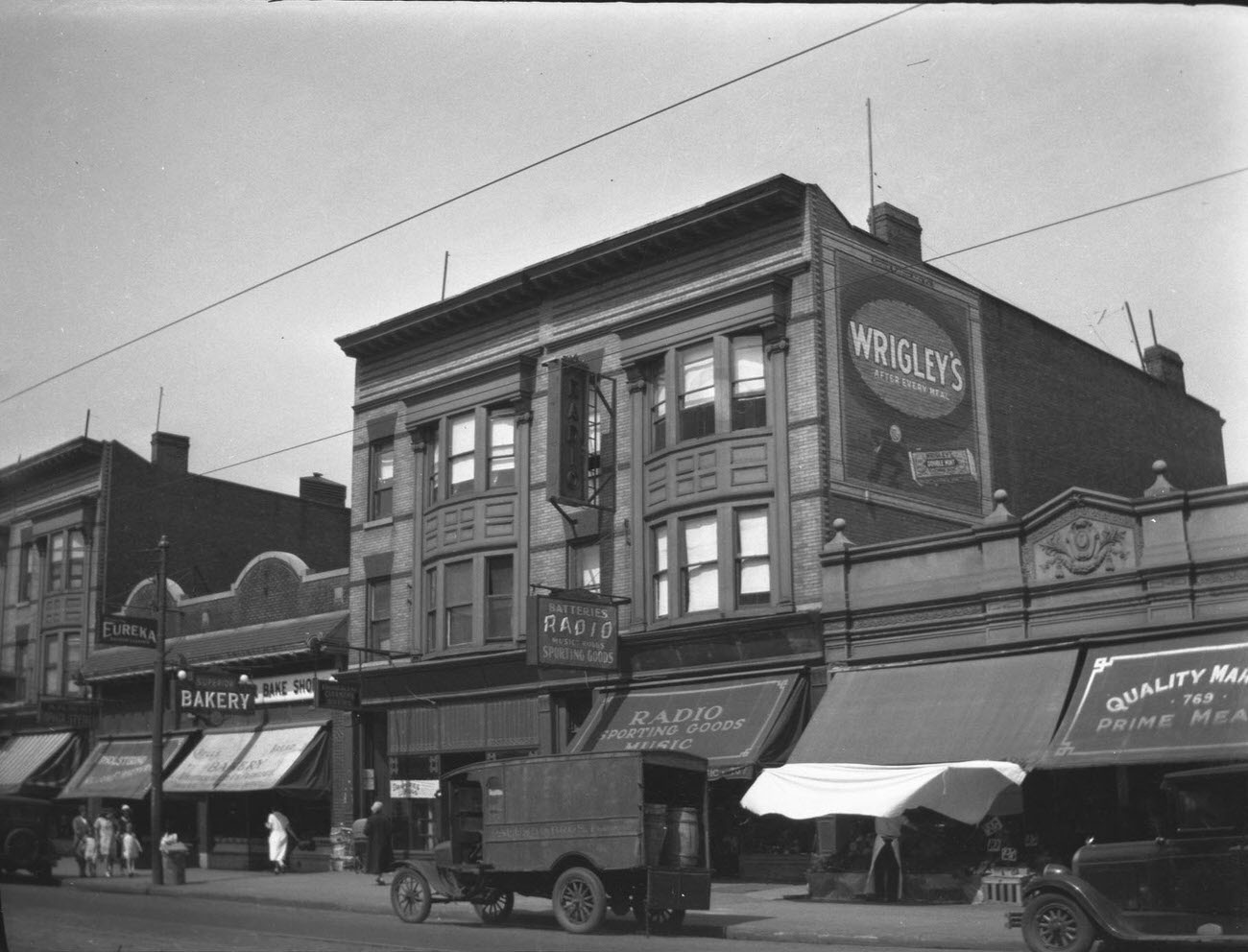 Exterior View Of Lenox Sport Shop And Surrounding Businesses On Flatbush Avenue, 1910S