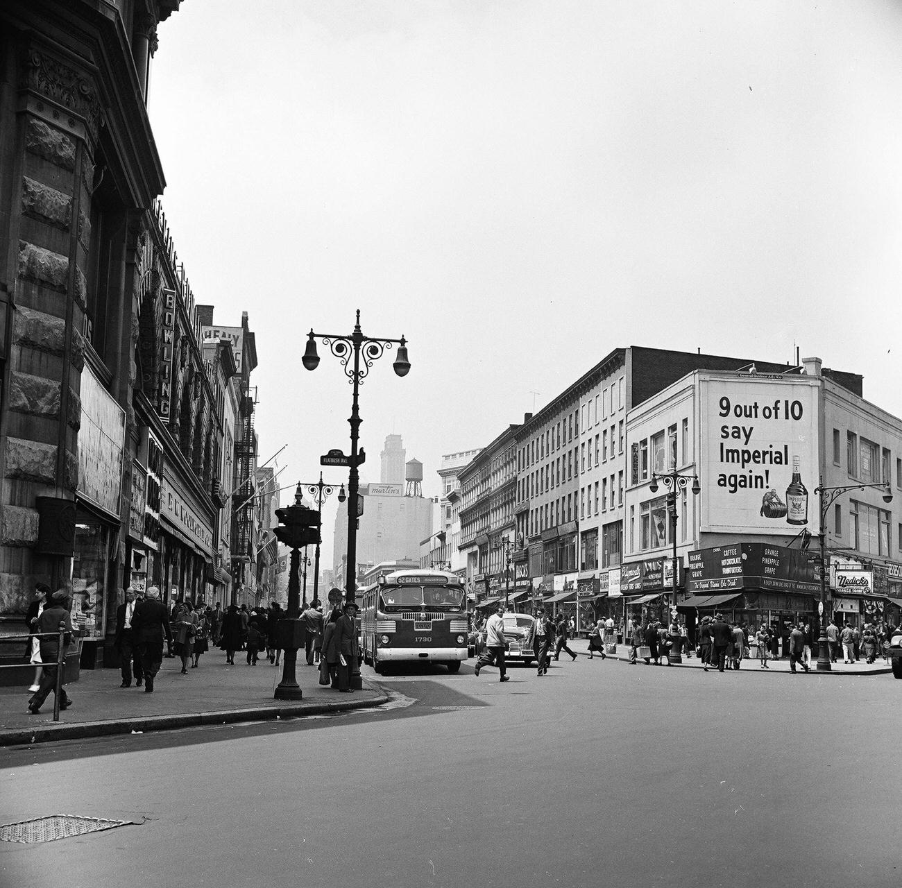 View Of Pedestrian And Street Traffic Along Fulton Street, Looking West From The Intersection With Flatbush Avenue, 1948