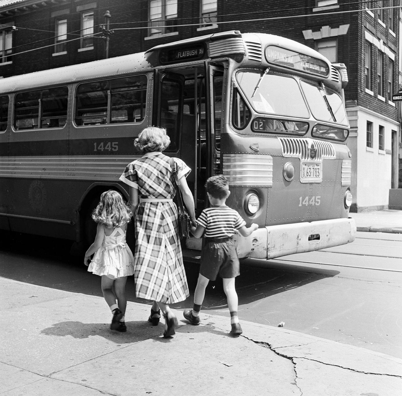 A Mother Leads Her Two Young Children, A Boy And A Girl, Towards The Flatbush Avenue Bus, Coney Island, New 1948