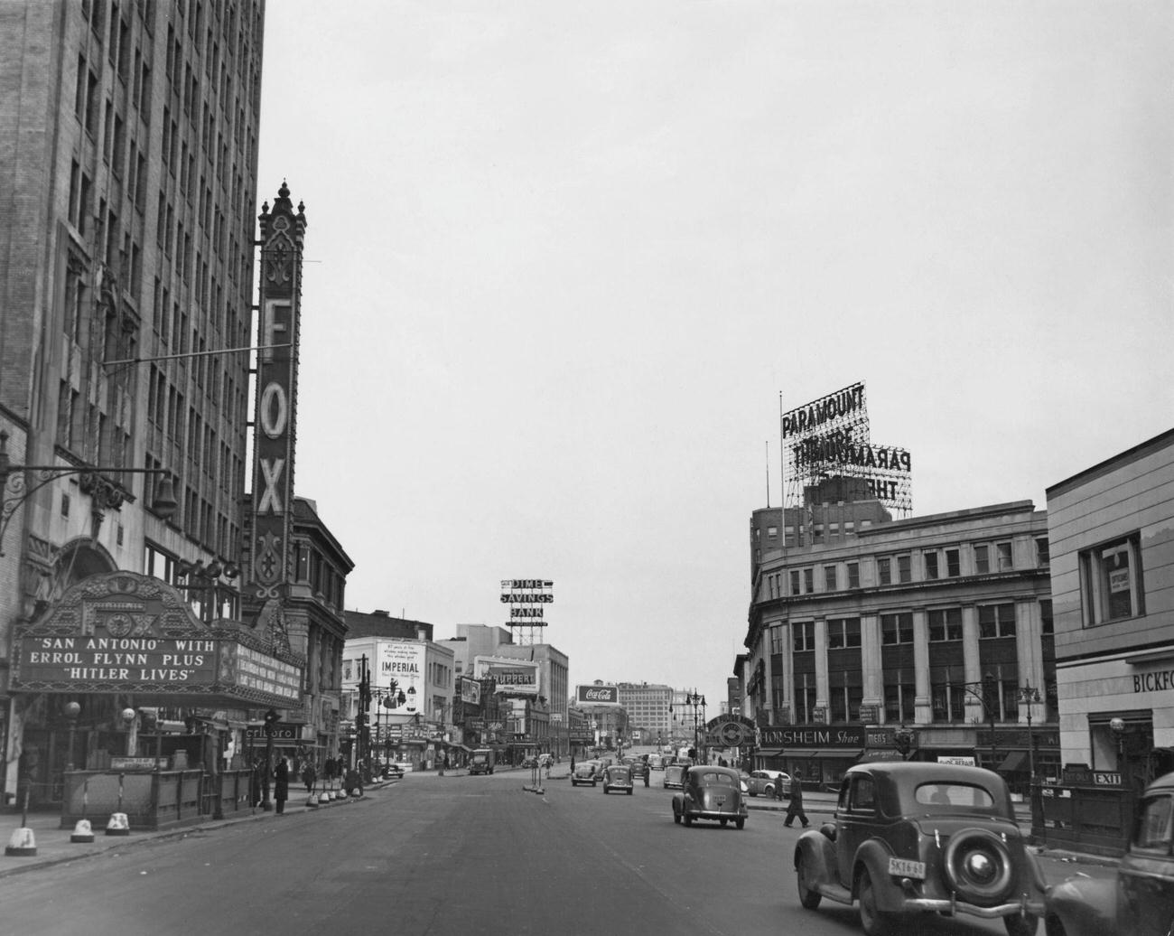 A View Down Flatbush Avenue In Brooklyn, New York City, 1945. On The Right Is The Paramount Theatre, And On The Left Is The Fox Theatre, Showing 'San Antonio', With Errol Flynn, And Don Siegel'S 'Hitler Lives'.