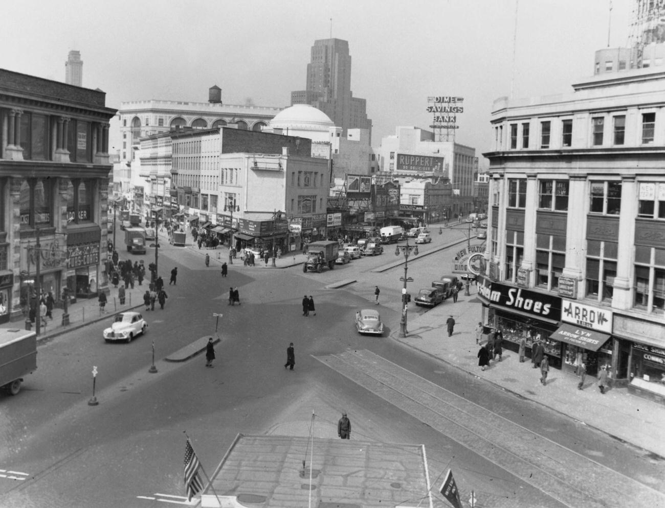 High Angle View Showing Pedestrians And Traffic At The Intersection Of Fulton Street And Flatbush Avenue In Brooklyn, New York City, New York, 1949.