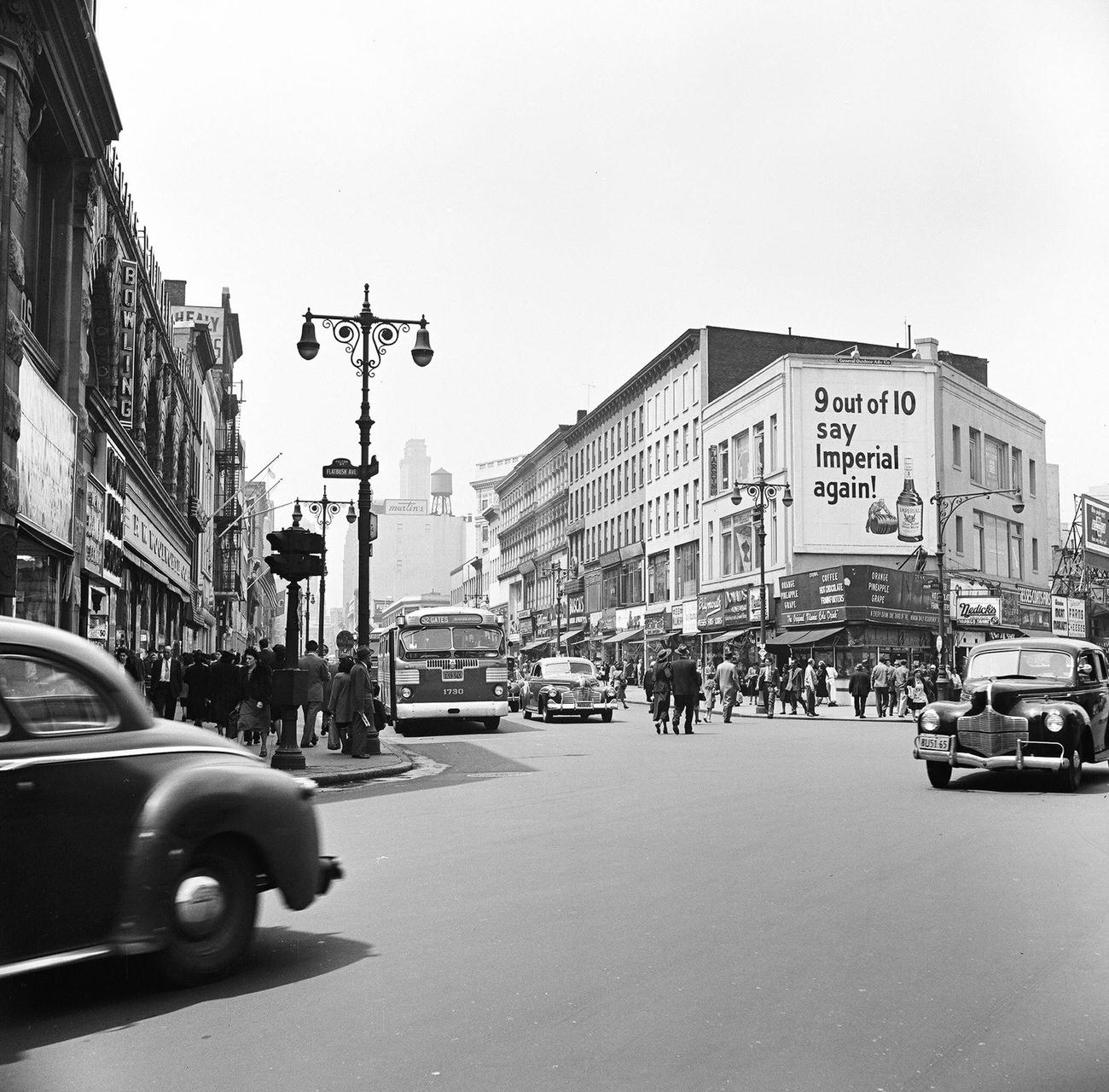 View Of Pedestrian And Street Traffic Along Fulton Street, Looking West From The Intersection With Flatbush Avenue, Brooklyn, 1948