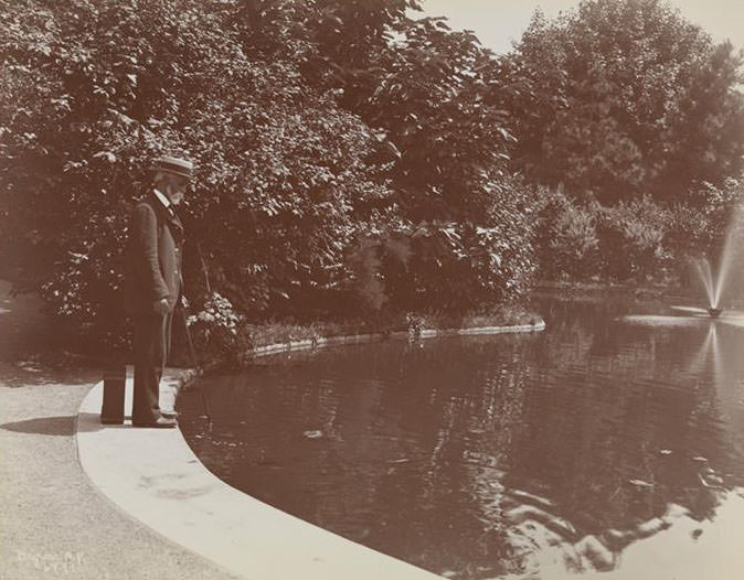A Man Standing By A Pond At Sailor'S Snug Harbor, A Facility And Home For Retired Sailors On Staten Island, 1899