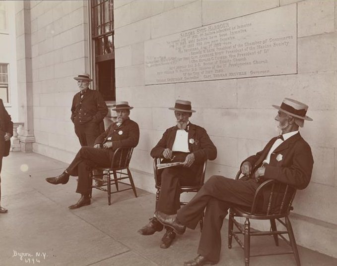 Men Seated And Standing On The Porch Of A Building At Sailor'S Snug Harbor, A Facility And Home For Retired Sailors On Staten Island, 1899
