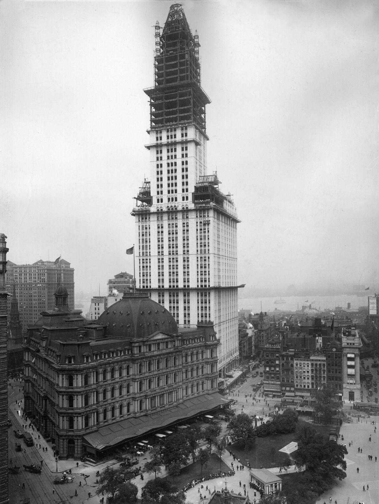 View Of The Woolworth Building Under Construction, New York City. Designed By Cass Gilbert, It Was Completed In 1913, And Claimed Title As The World'S Tallest Building Until 1930.