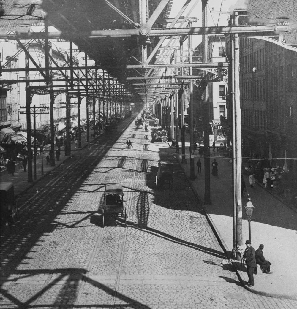 Elevated Rail Line, The Bowery: Carriages And Pedestrians Beneath The Tracks, Manhattan, New York City, 1895.