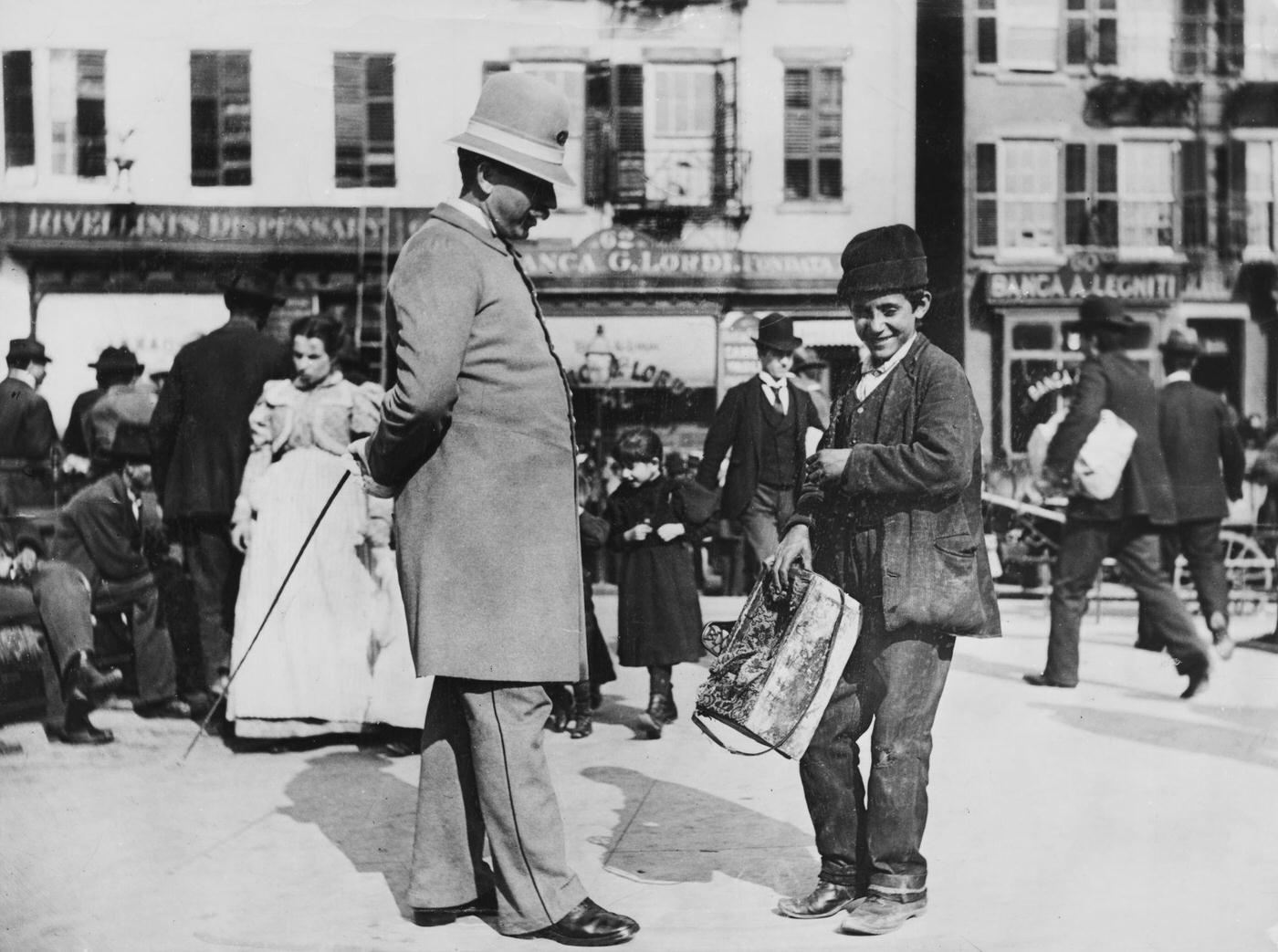 New York City Street Scene: Young Shoeshine Boy With Policeman On Mulberry Street, Lower Manhattan, New York City, 1897.