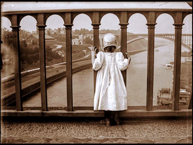 Girl on Highbridge, Manhattan to the left, the Bronx to the right, Washington Bridge in the distance, 1900