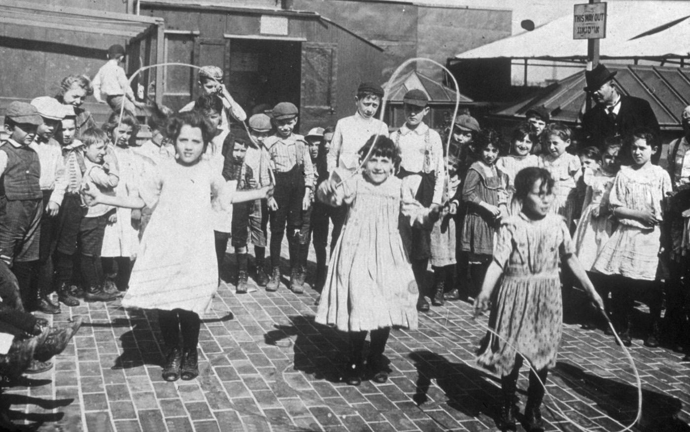 Three Girls Jump Rope, Rooftop Playground of Hebrew Institute, East Broadway and Jefferson Streets, Manhattan, New York City, Circa 1900