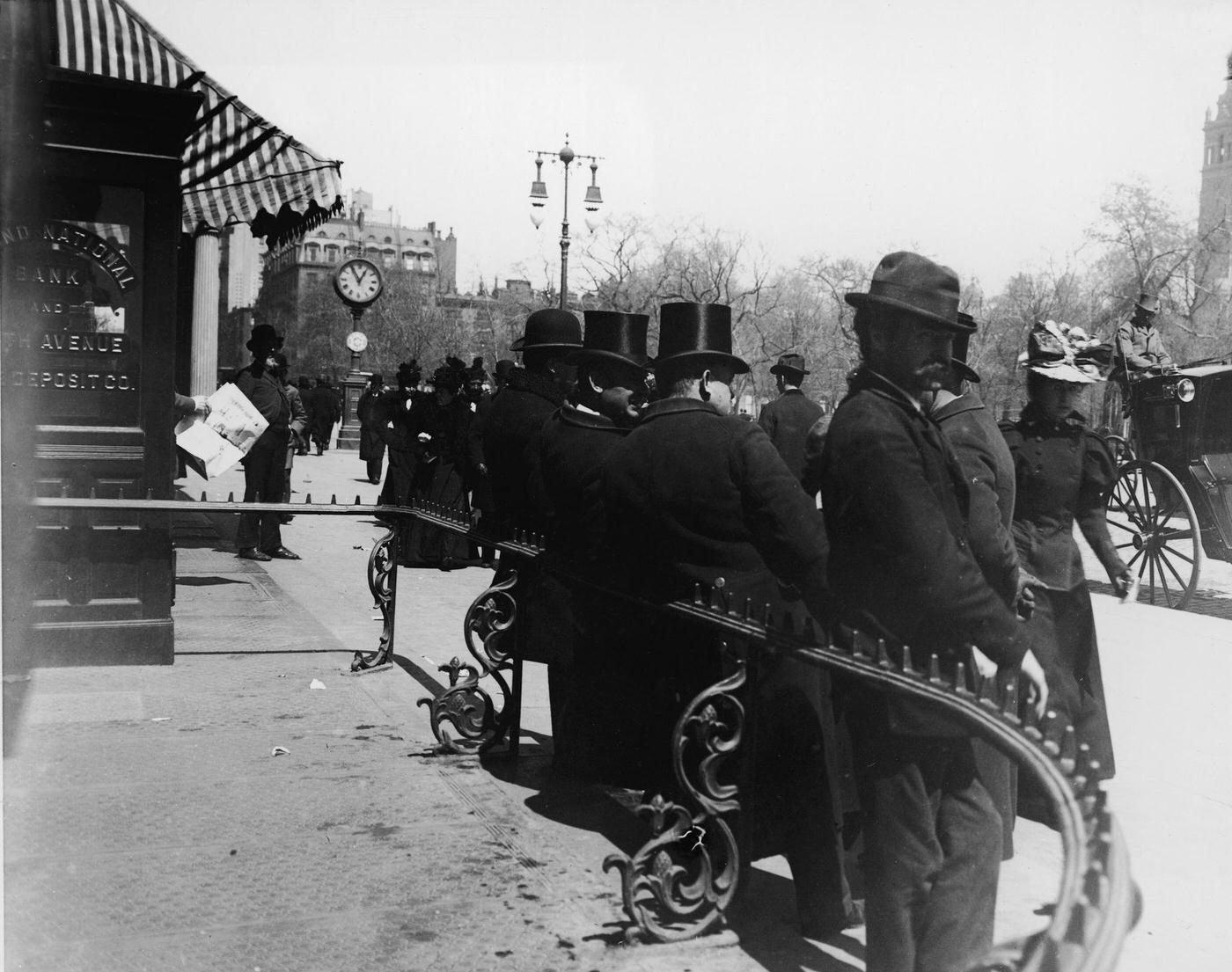 Men Leaning Against a Railing in Madison Square Park, Fifth Avenue and 23rd Street, Manhattan, New York, 1900s