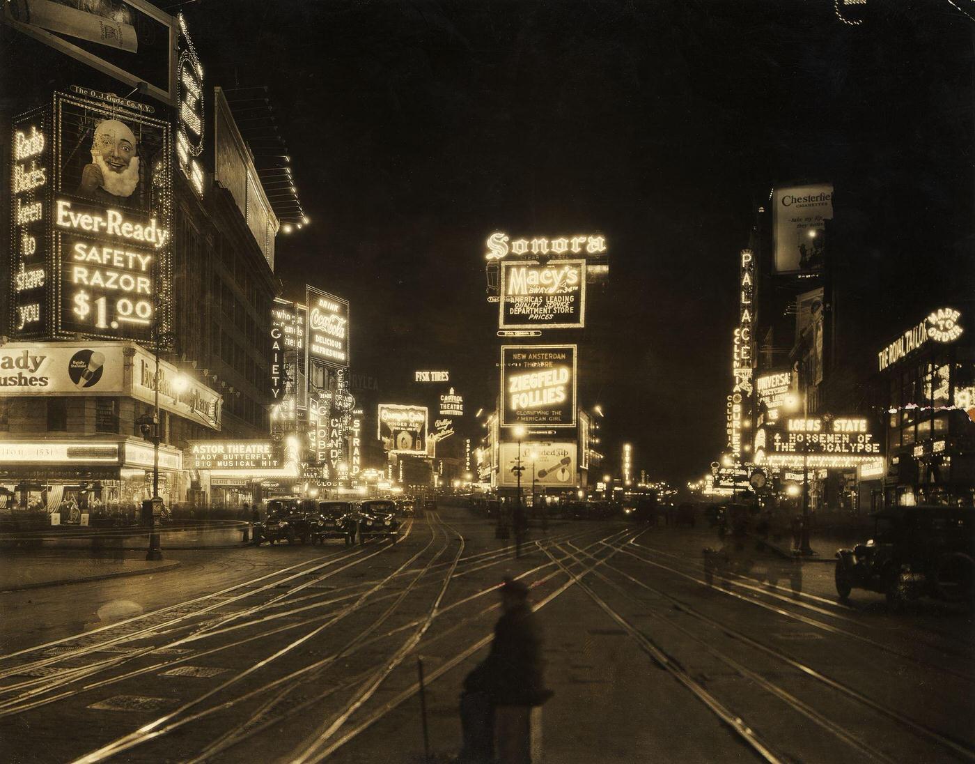 View Of Traffic And Illuminated Advertisements In Times Square At Night, Manhattan, 1921.