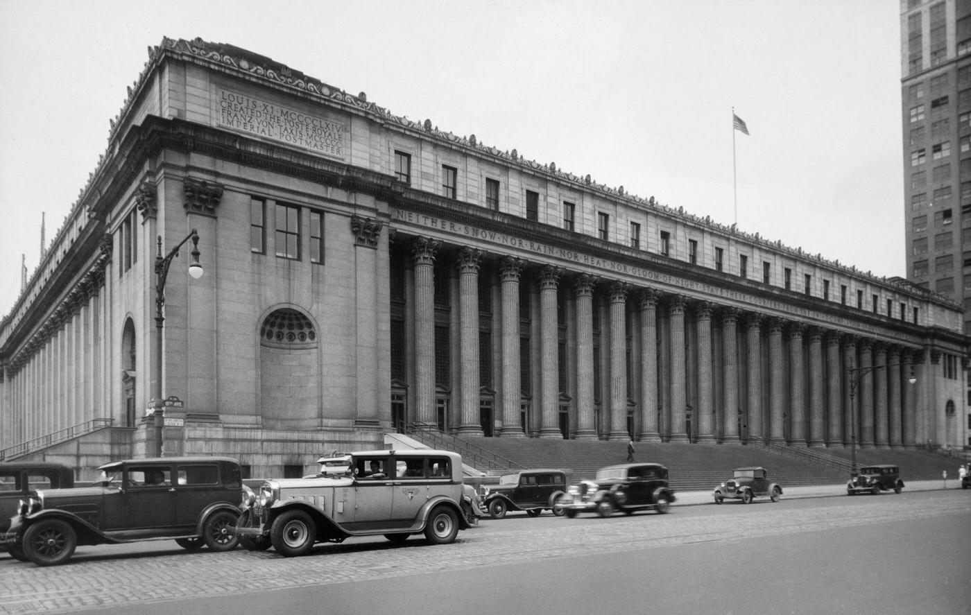 General Post Office Building, Cars Passing and an Inscription Above the Colonnade Bears the U.S. Postal Service Creed on Eighth Avenue, Manhattan, 1935.