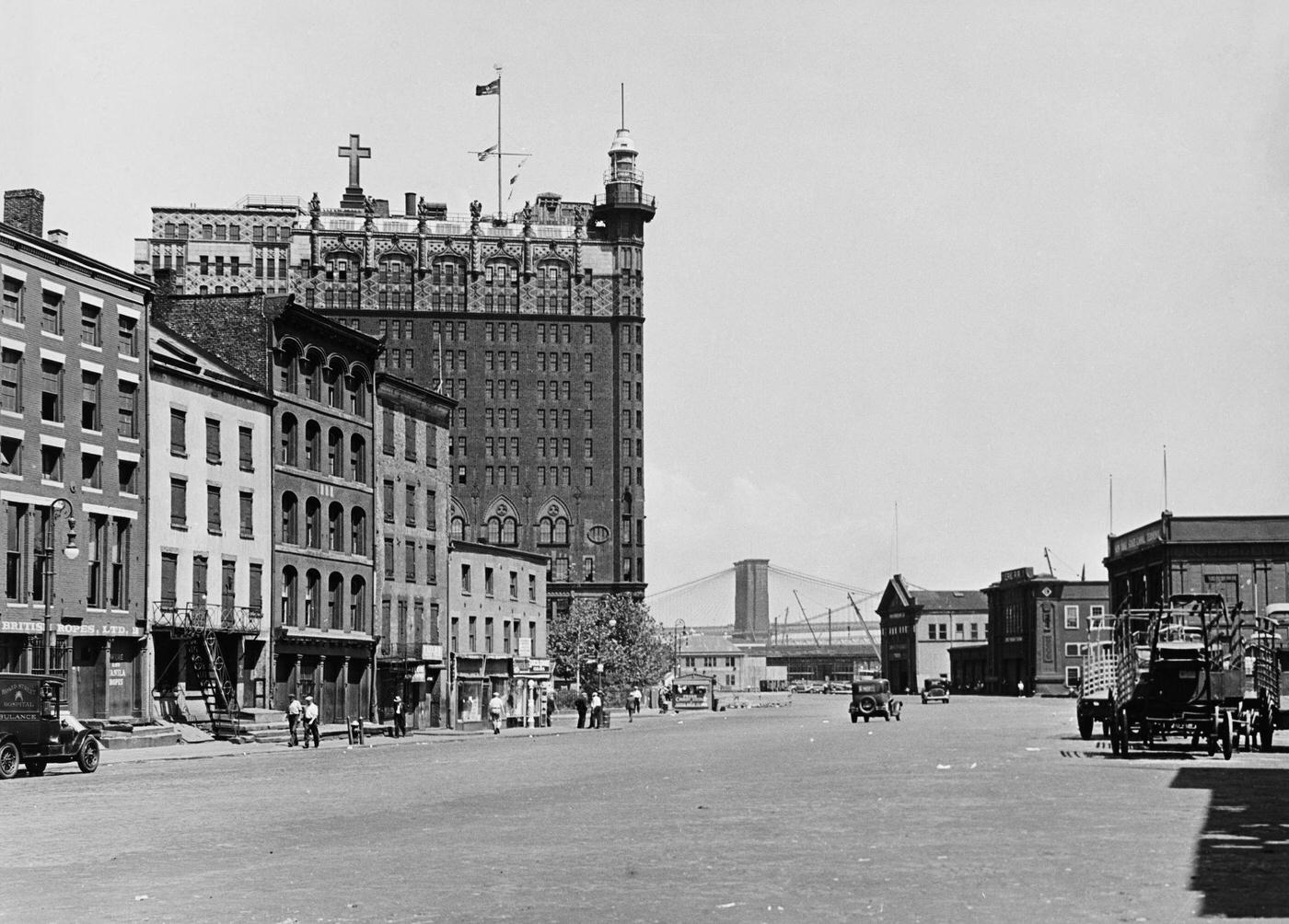 View Looking North Along South Street, Lower Manhattan, Including the Seamen's Church Institute and the Brooklyn Bridge, Manhattan, 1930s