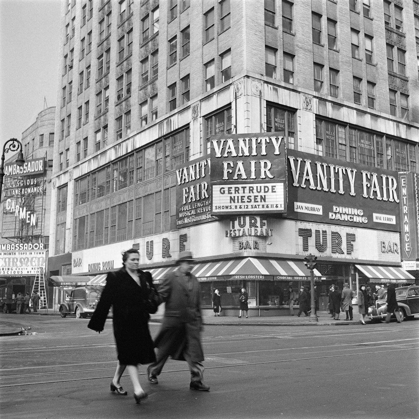 A Couple Crosses The Street At Broadway And West 49Th Street, Near Ambassador Theatre In Times Square, Manhattan, 1947