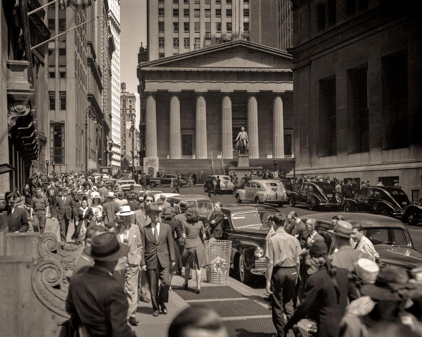 Pedestrians On Sidewalk And Automobile Traffic In Front Of Stock Exchange Building, Wall Street, Manhattan, 1940S