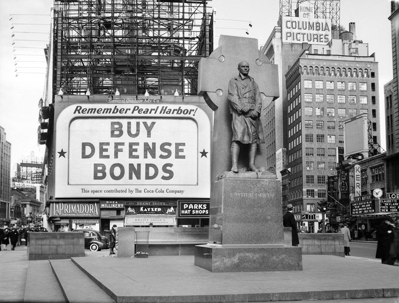 Buy Defense Bonds Billboard At Statue Of Father Duffy At Times Square, Manhattan, 1940S