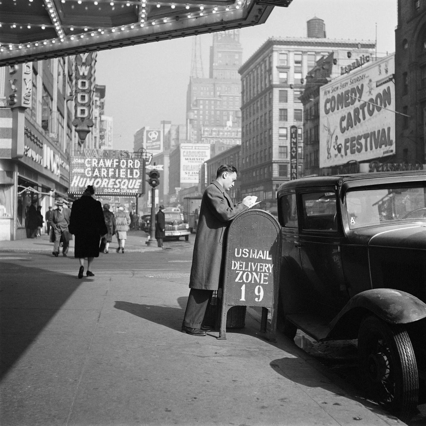 A Man Prepares Mail In Front Of The Capitol Theater Near Lindy'S Restaurant, Manhattan, 1947