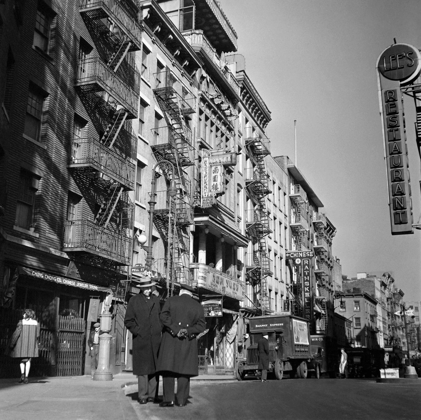 Two Men Chat In Mott Street, Near The Merchants Club, Chinatown, Manhattan, 1947