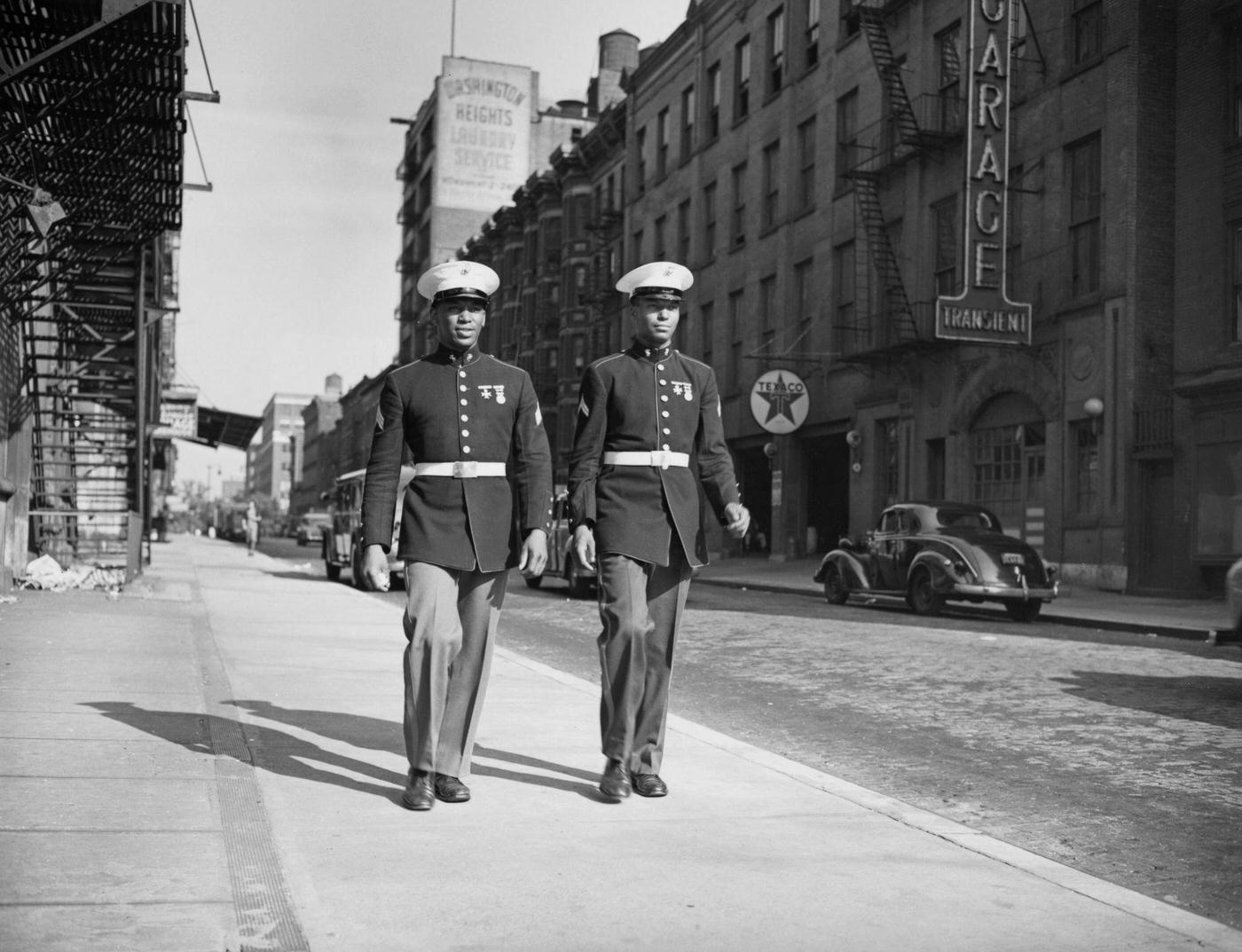 Two Marines Walk Down A Street In Harlem, Manhattan, 1943.
