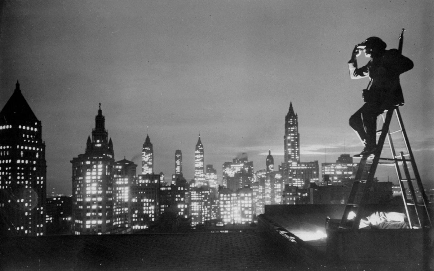 American Legion Roof Spotter Benjamin Franklin Enjoys The New York Skyline, Manhattan, 1940.