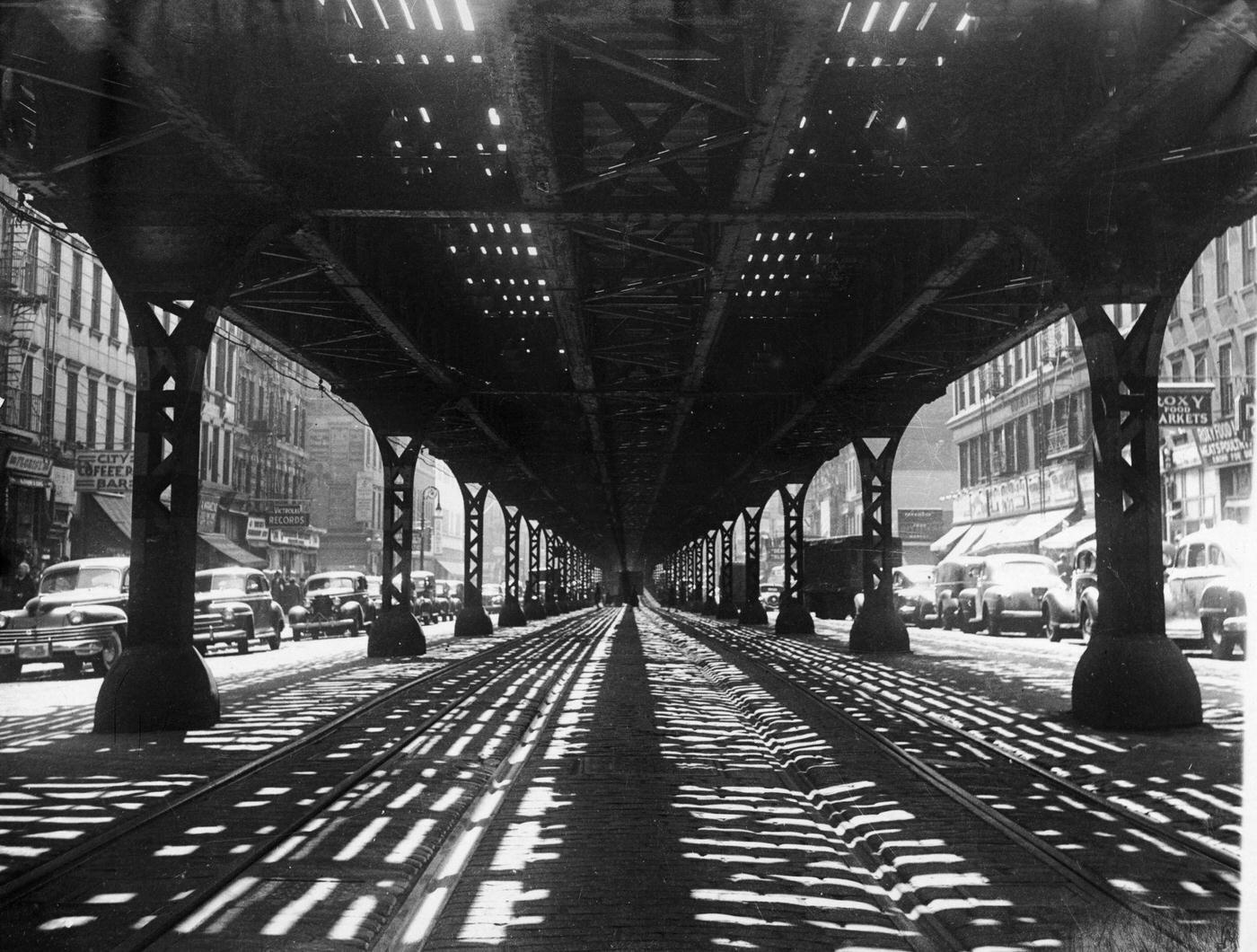 Long View Beneath The Third Avenue Elevated Train Tracks, Manhattan, 1940.