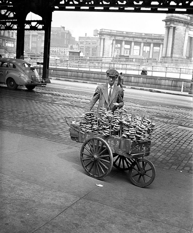 A Pretzel Vendor Displays His Wares On An Approach To The Manhattan Bridge In New York City, April 29, 1948.