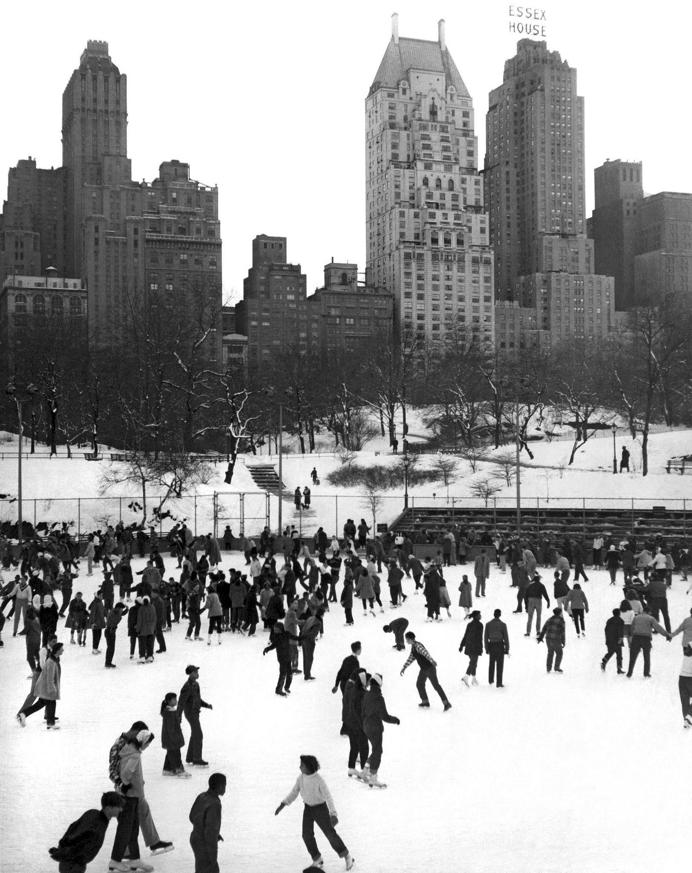 Ice Skating In Central Park At The 59Th Street Rink With The Essex House In The Background, Manhattan, Circa 1952