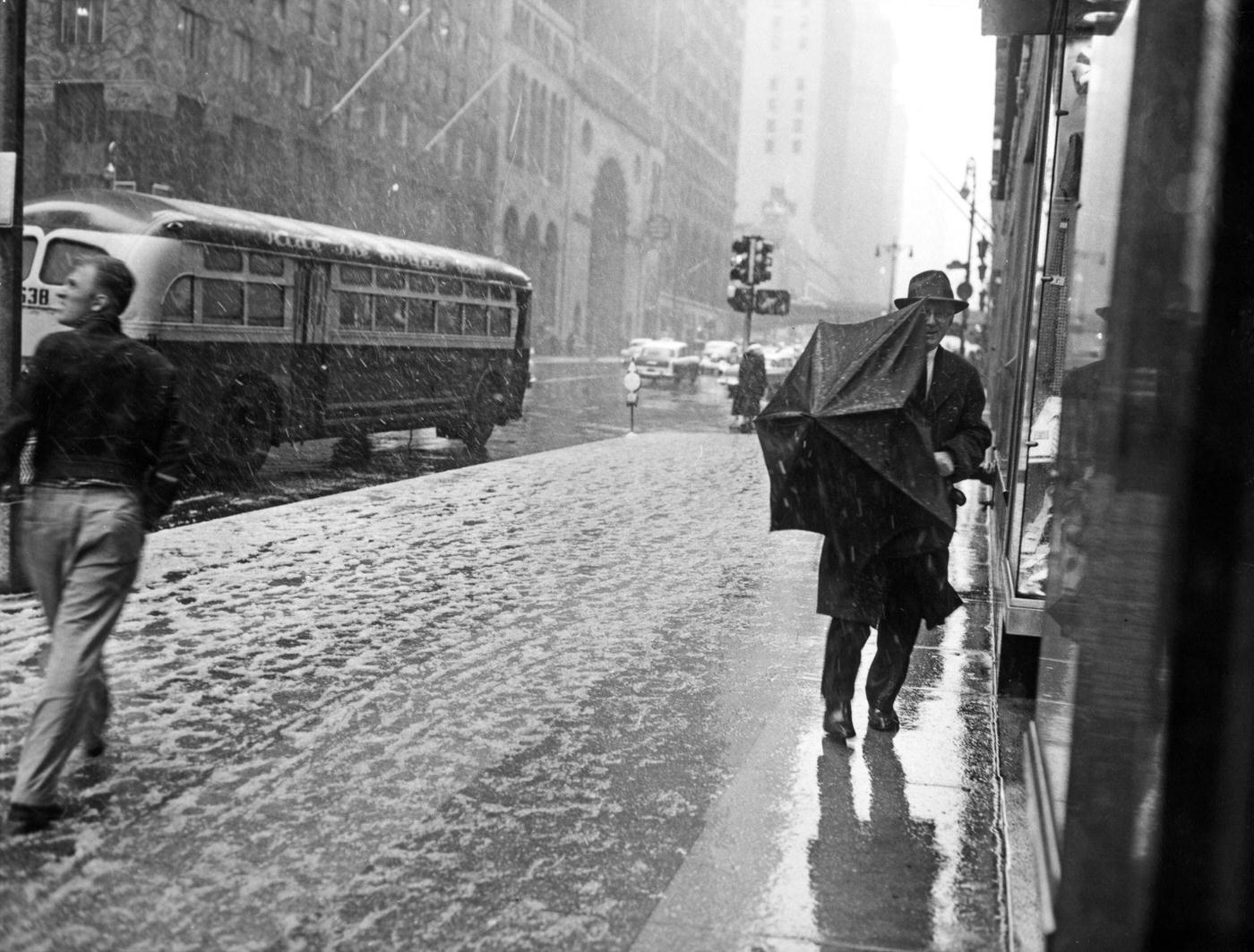 Blizzard Hits Manhattan: Pedestrian Struggles With An Umbrella On 42Nd Street And Lexington Avenue During A Blizzard, Manhattan, 1958.