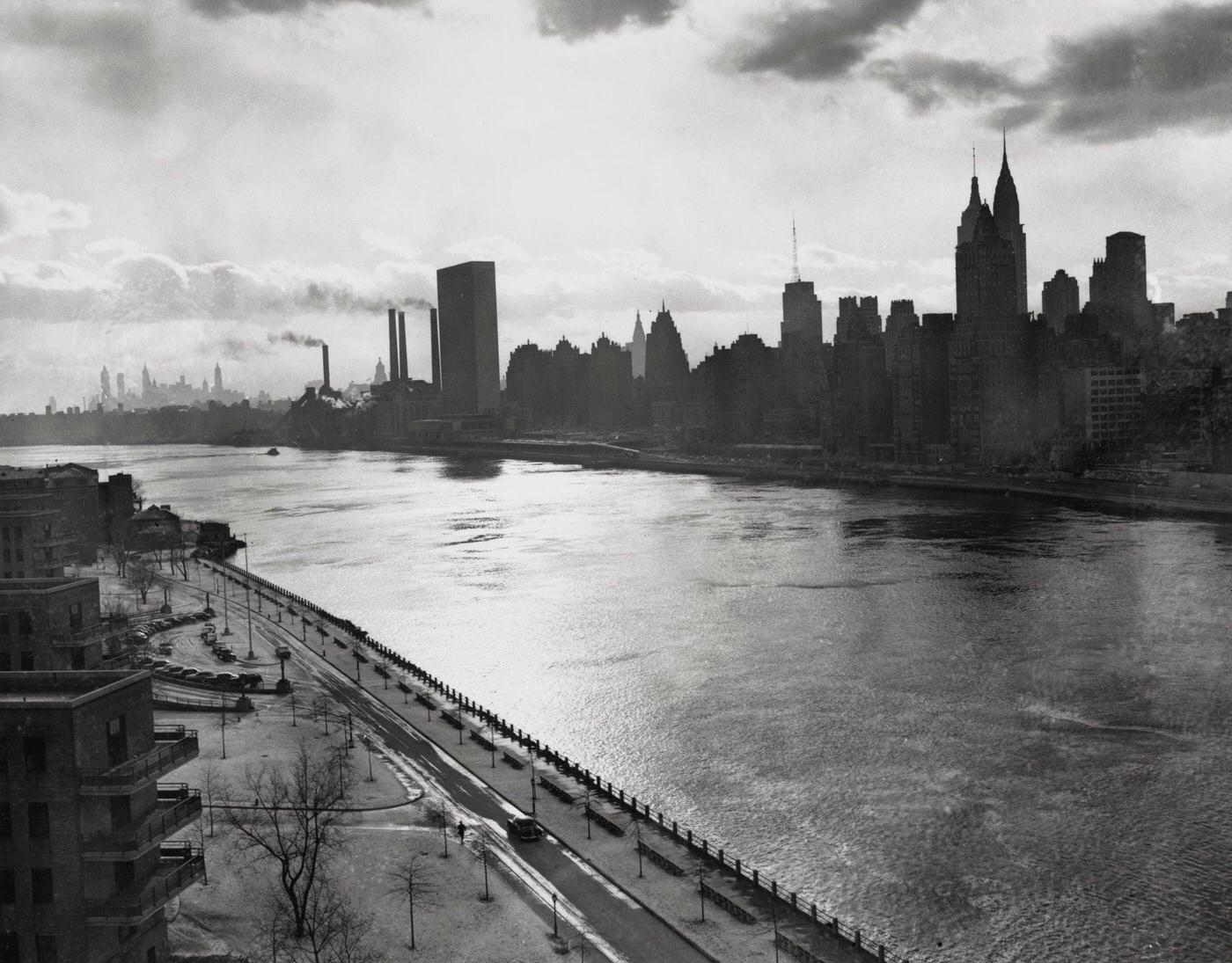 East River, New York City: Evening Falls Over The East River With Manhattan Skyline, 1951.