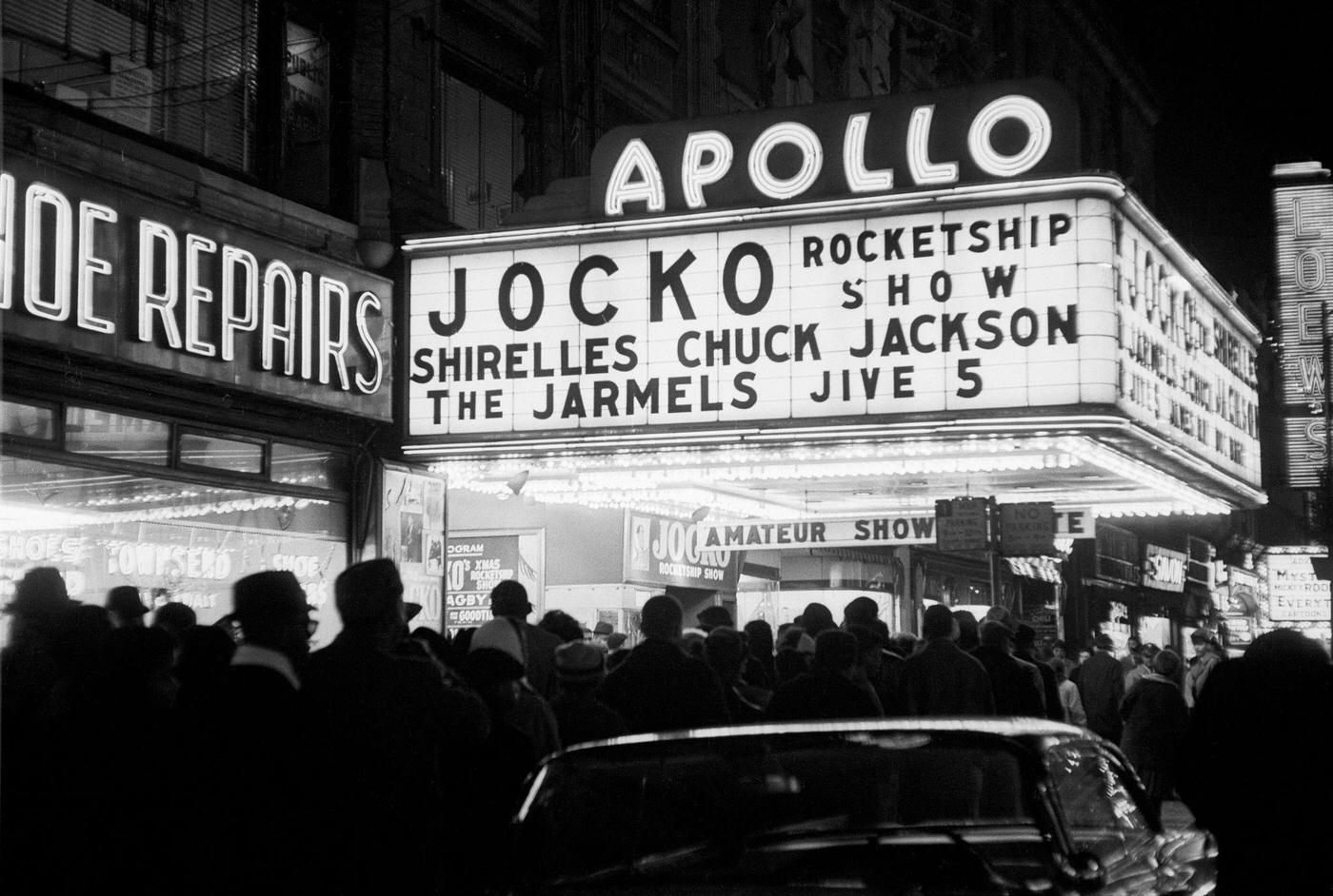 Nighttime View Of Crowd Lined Up Outside The Apollo Theater, Manhattan, 1961