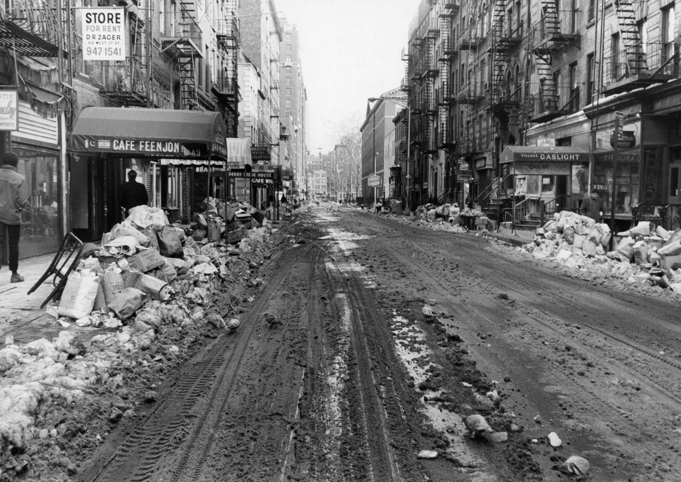 View Of Trash And Snow Piled Along Macdougal Street In Greenwich Village After A Blizzard, Manhattan, 1969