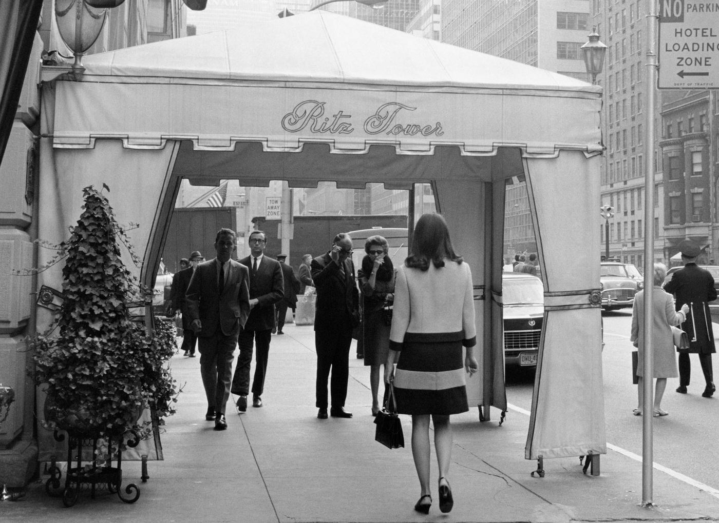 Pedestrians Walking Beneath The Covered Entrance To The Ritz Tower On Park Avenue In Midtown Manhattan, 1967