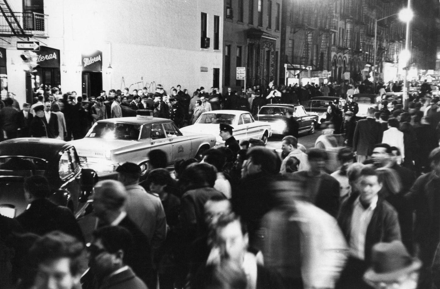 Nighttime View Of Pedestrians And Cars On Macdougal Street In Greenwich Village, Manhattan, 1966