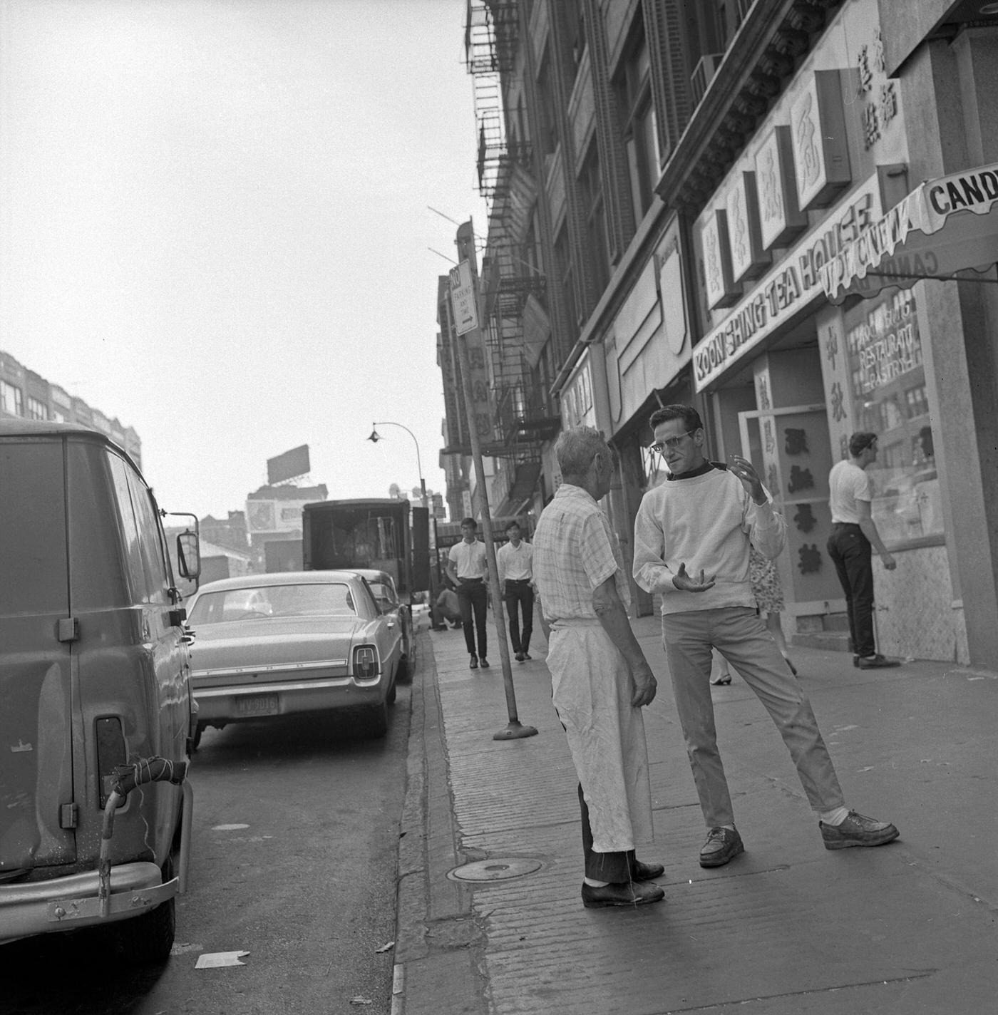 View Of Two Men Talking On Canal Street In Chinatown, Manhattan, 1968