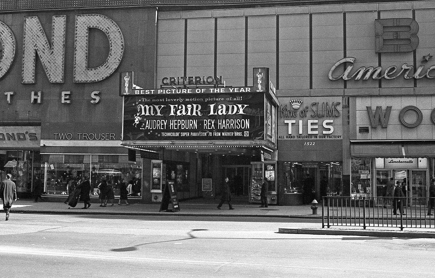 Pedestrians Walking Past Criterion Theater Advertising 'My Fair Lady' In Times Square, Manhattan, 1966