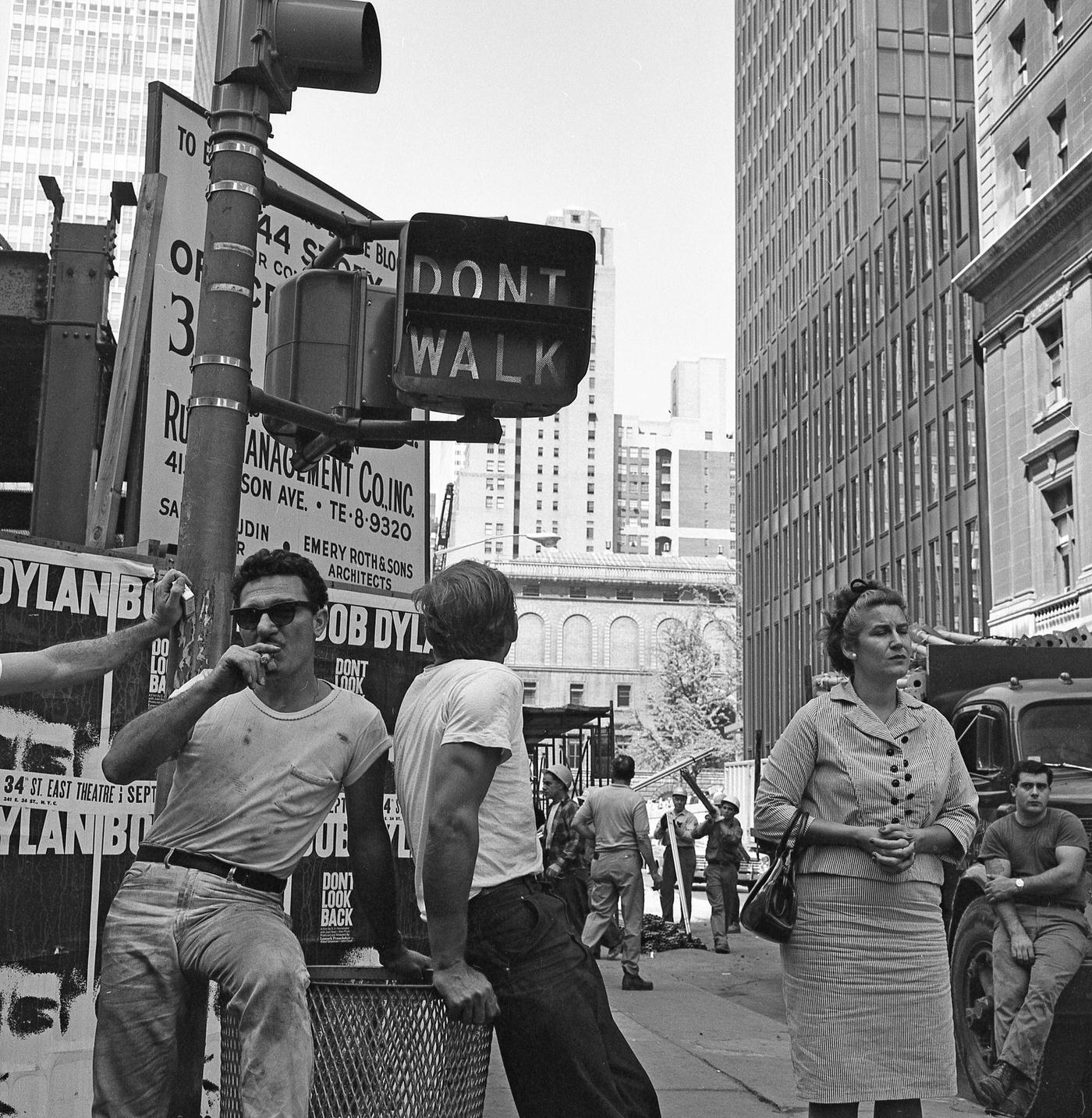 Two Construction Workers Leaning Against A Trash Can On Lexington Avenue, Manhattan, 1967