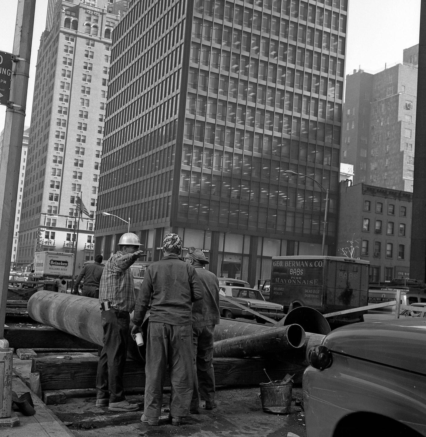 View Of Three Construction Workers Taking A Break At A Job Site On 6Th Avenue, Manhattan, 1967.
