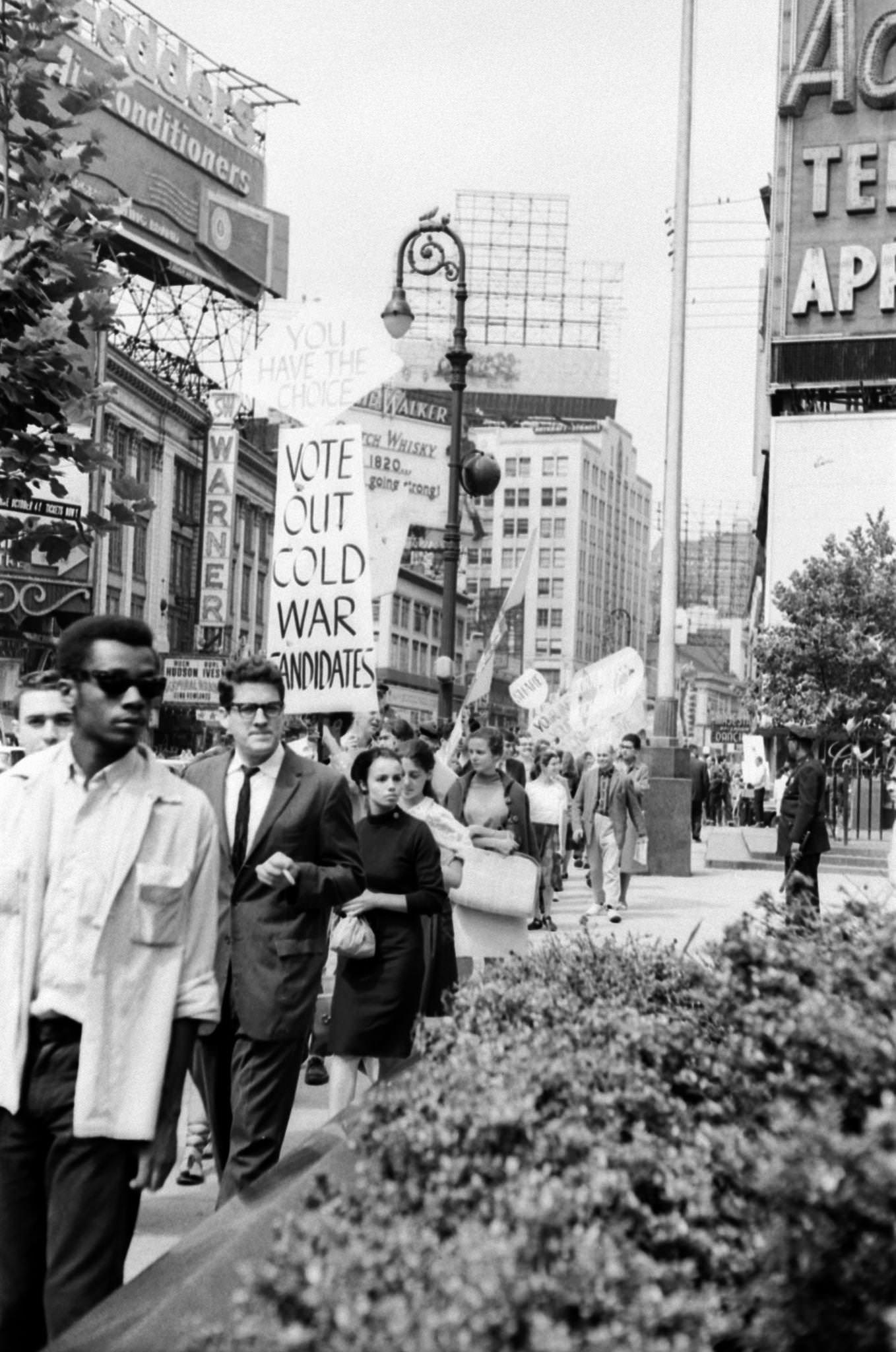 A View Of People Protesting In Times Square Against War And Atom Bomb Testing In The Us And Russia, Manhattan, 1965.