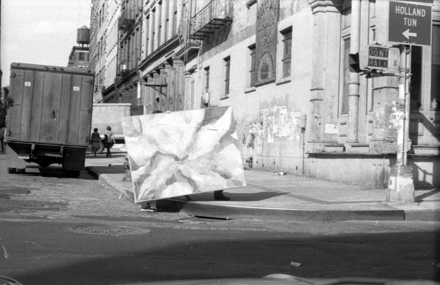 View Of Large Work Of Art Carried Across Intersection From Broome Street, Manhattan, 1974