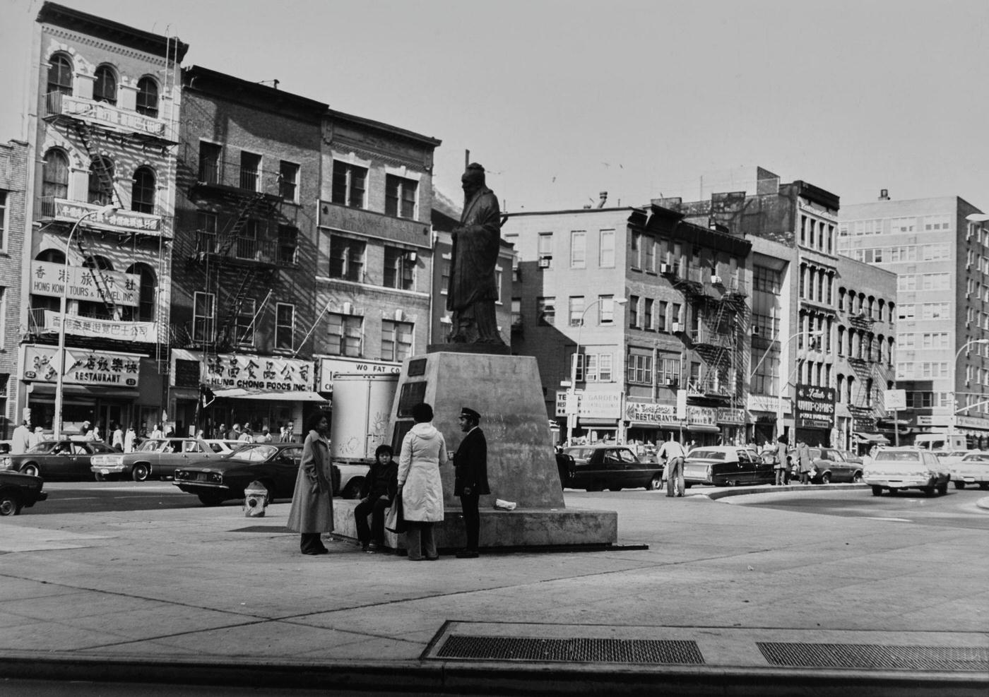 Group Around Statue Of Confucius On Confucius Plaza In Chinatown, Lower Manhattan, Manhattan, 1978