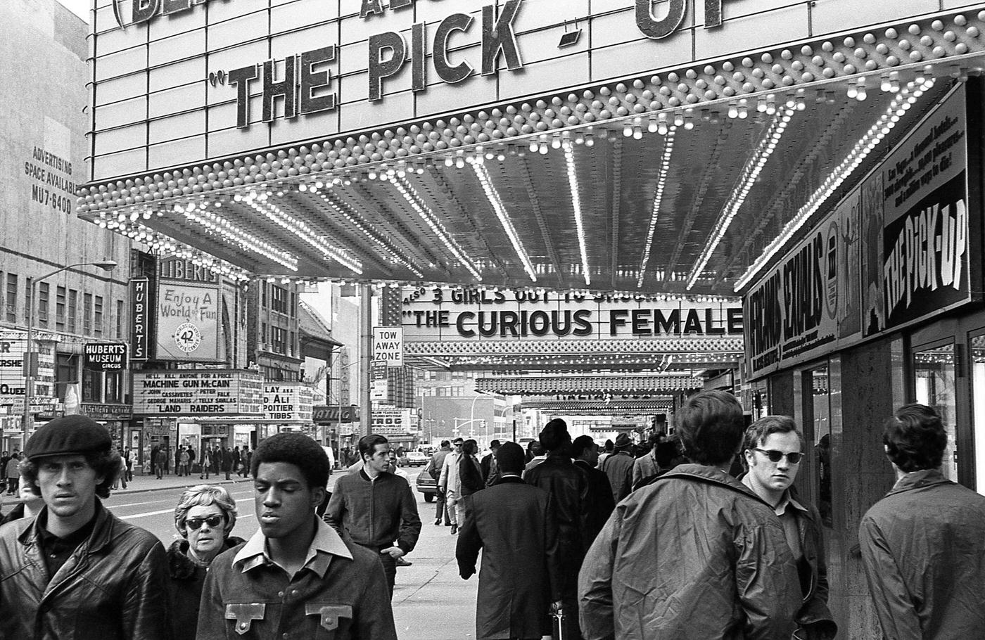 Pedestrians Walk Under Adult Movie Theater Marquees In 42Nd Street, Times Square, Manhattan, 1970