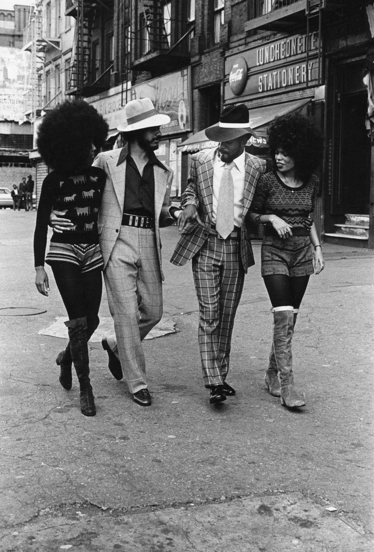 Four People Walking On A Street In Harlem, Manhattan, 1971