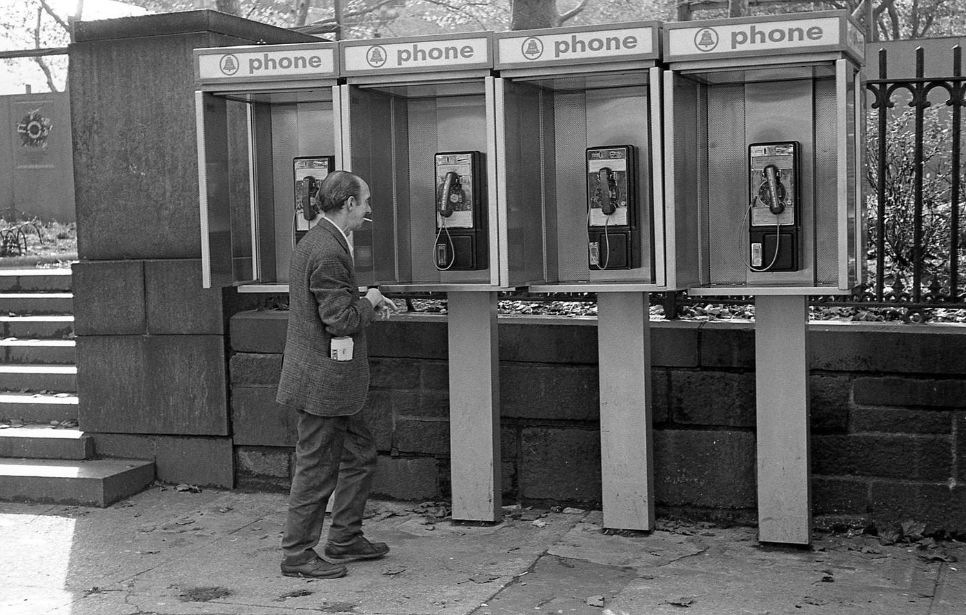 Man Approaches Row Of Pay Phones Near Bryant Park, Midtown Manhattan, 1970