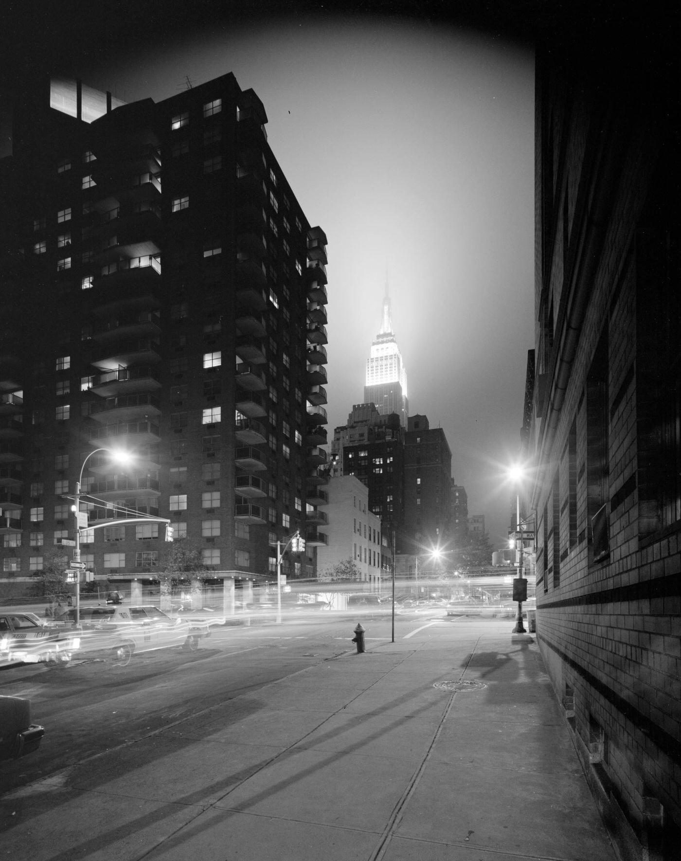 Nighttime View On East 35Th Street, Empire State Building In The Distance, Manhattan, 1975