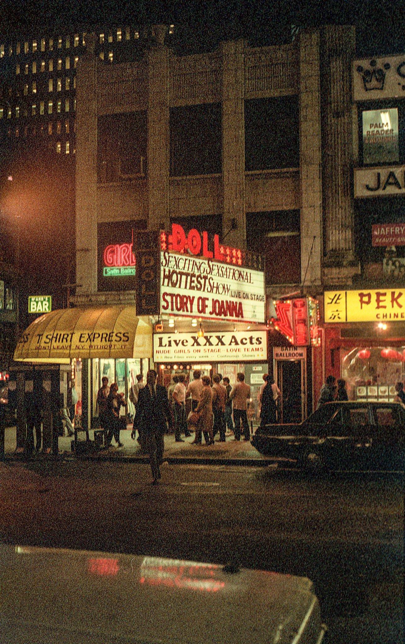 Group Of People Gathered In Front Of The Doll Theatre In Times Square, Manhattan, 1984.