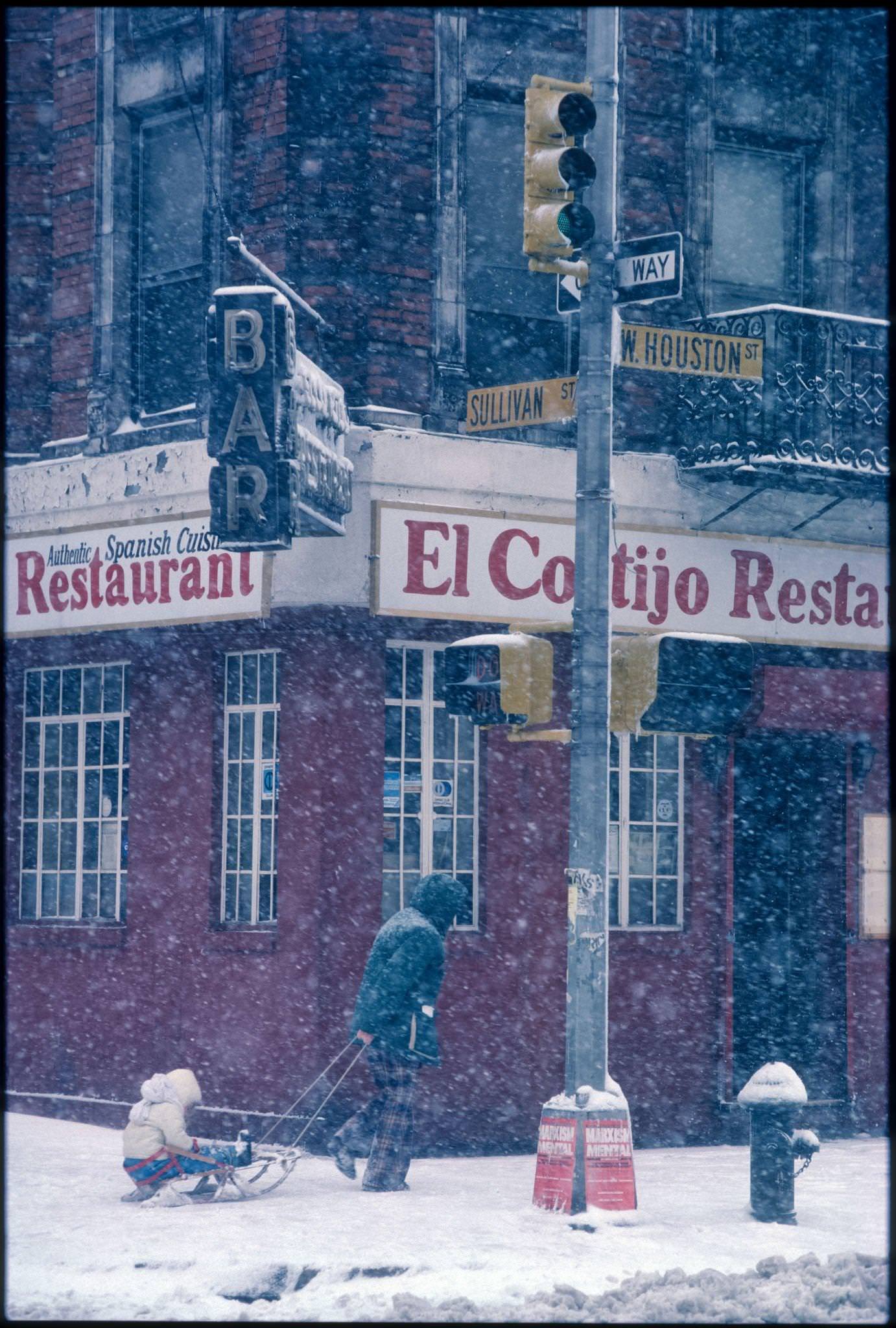 Adult Pulls A Child On A Sled On West Houston Street, Greenwich Village, Manhattan, 1982.