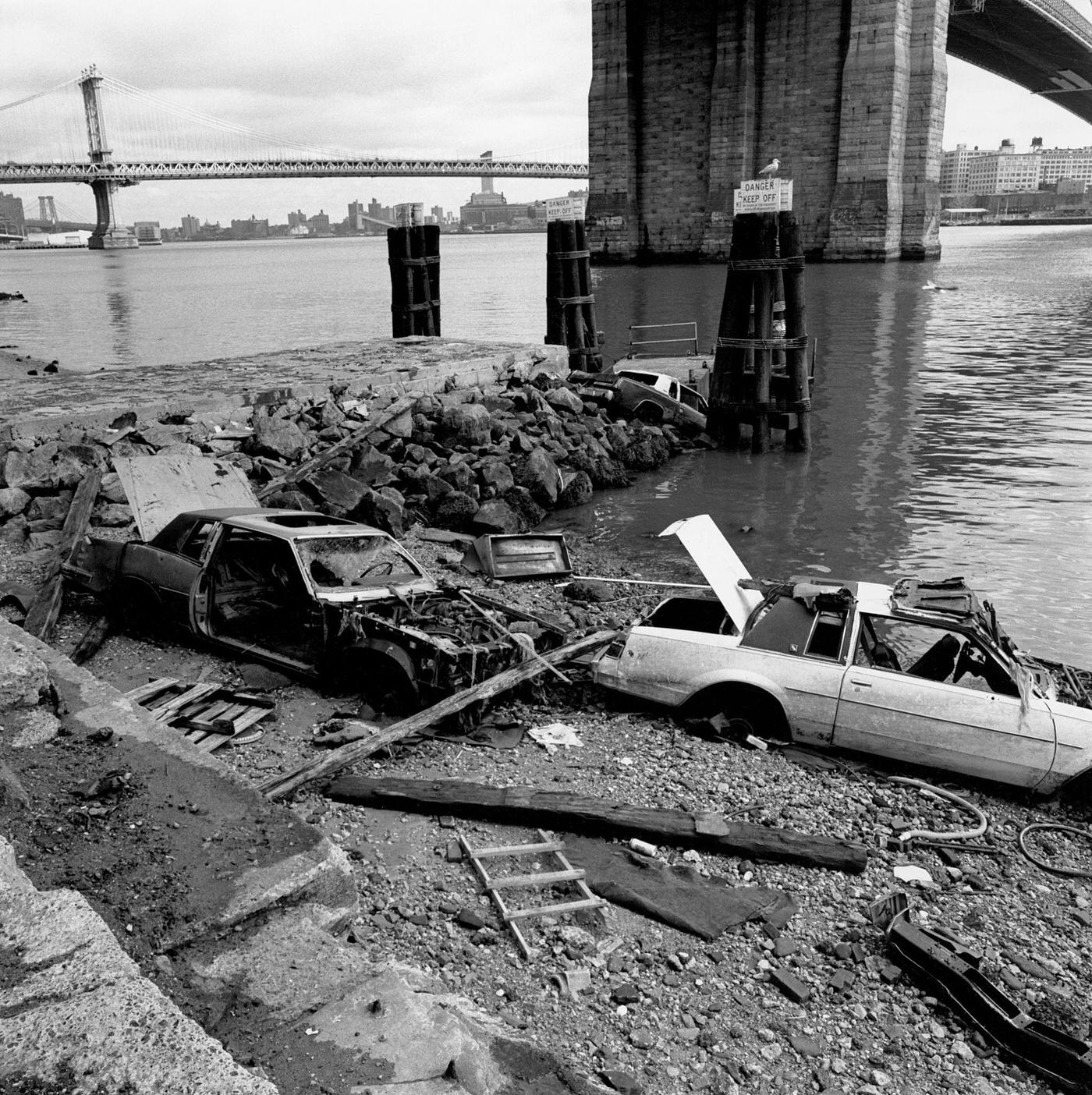 Abandoned Cars Under Brooklyn Bridge, Two Abandoned Cars Under The Brooklyn Bridge With Manhattan Bridge And East River In Background, Manhattan, 1990